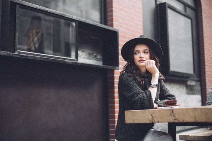 young woman cafe alone city hipster