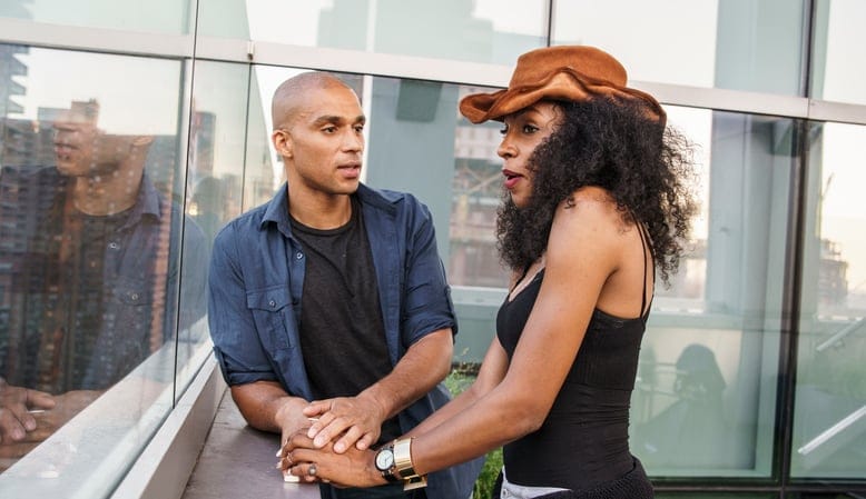 Young Latino couple have dinner and dating on rooftop