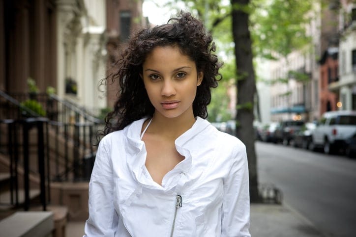Black woman walking street