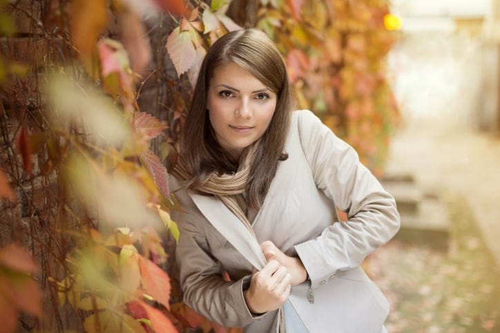 Autumn leaves brunette woman