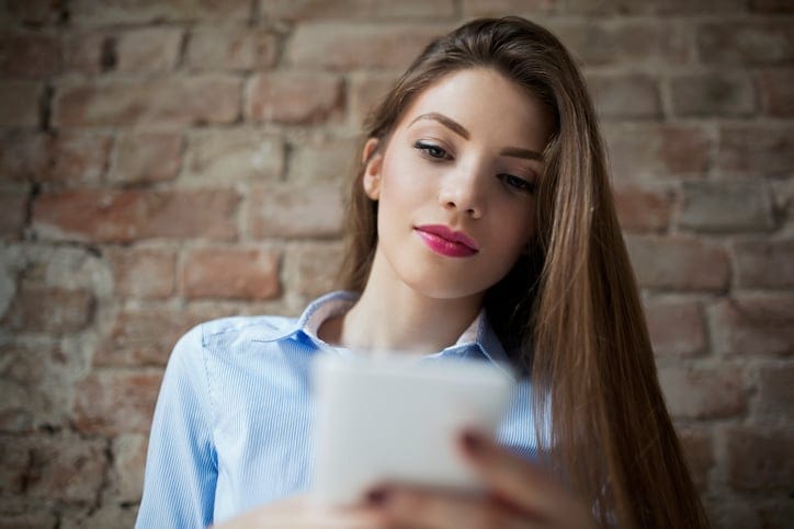 young woman texting phone