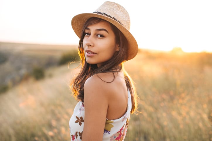 young woman portrait field fashion sun