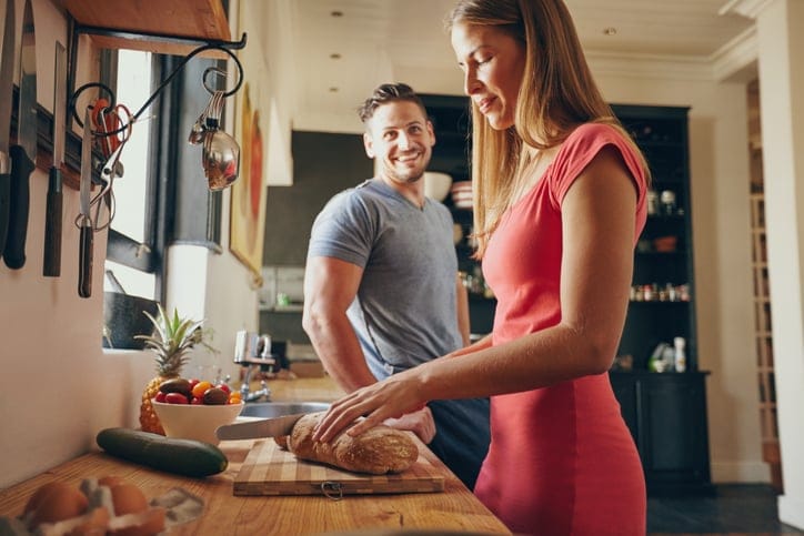 young couple kitchen cooking food relationship