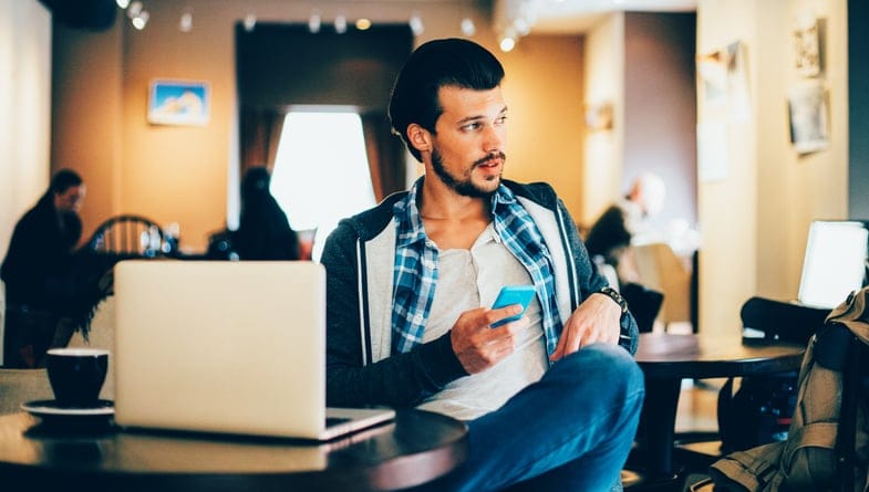 Man having a break in a coffee with a laptop.