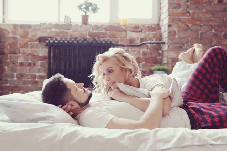 Lifestyle. Beautiful couple in bed