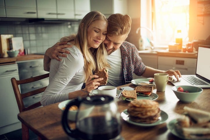 Couple enjoying breakfast together.