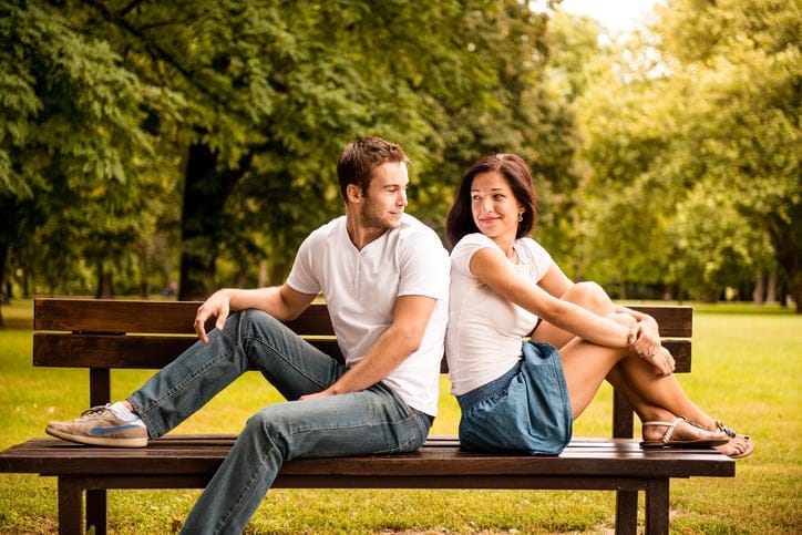 couple back to back bench outside