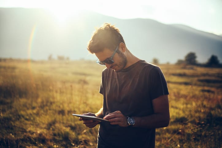 Young man enjoys relaxing in the nature