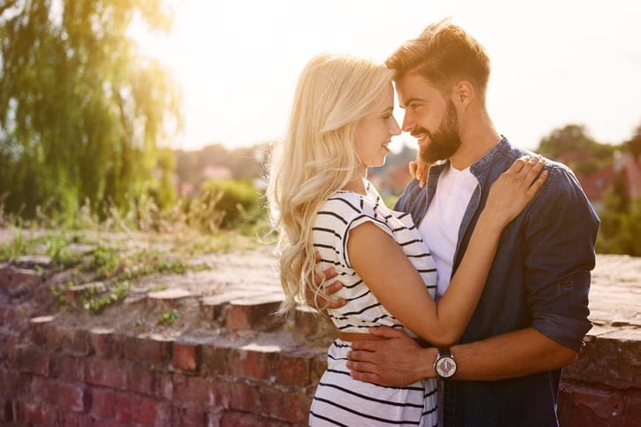 Man and woman embracing in the sunshine