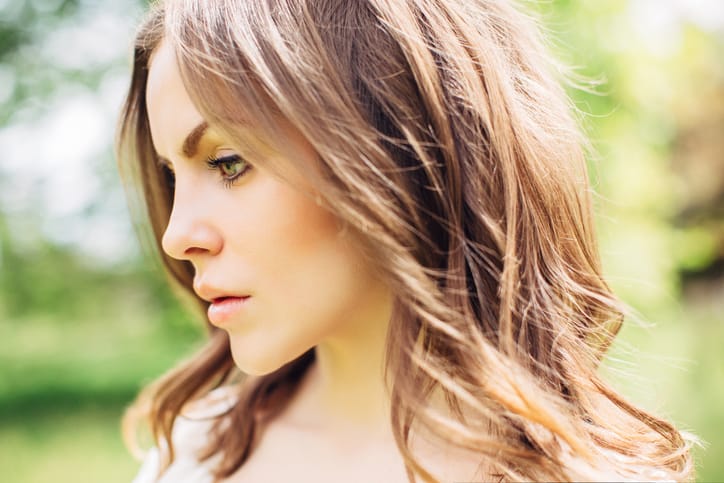 Beautiful woman on a background of summer forest
