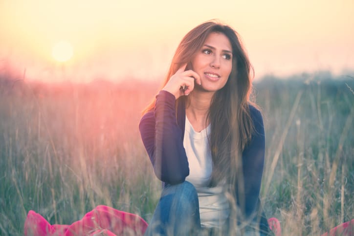 Lovely girl on the phone, afternoon outdoors