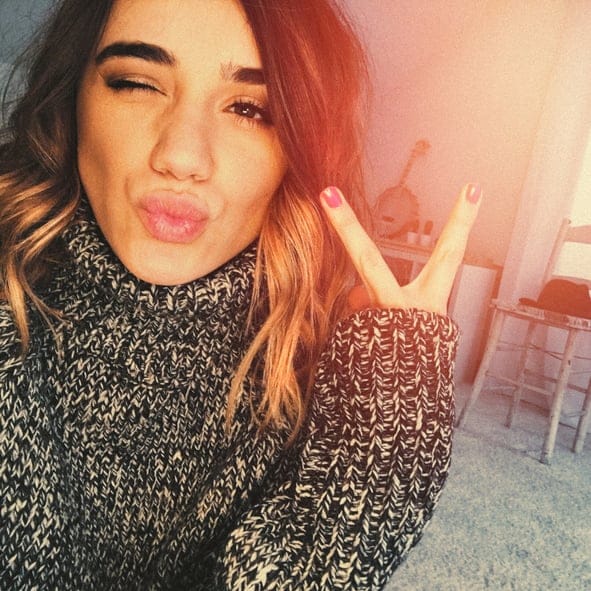 young pretty woman selfie peace sign