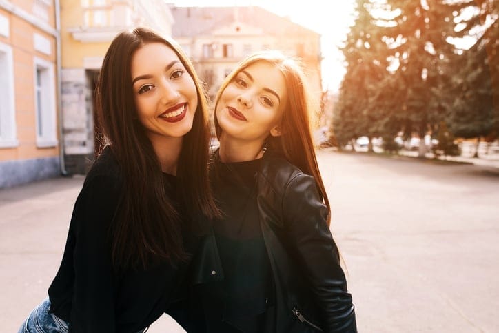 young women friends travel happy