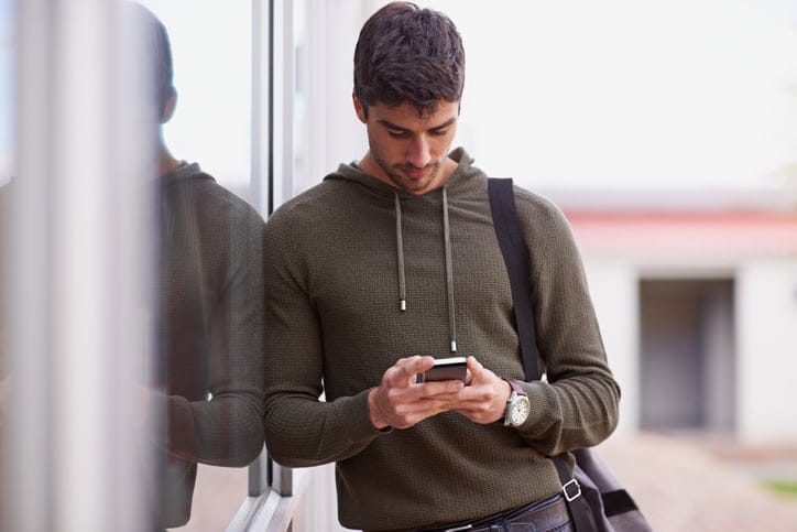 young guy texting handsome hot