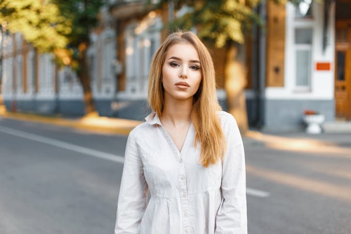 Beautiful stylish woman in stylish clothing posing on a sunny day