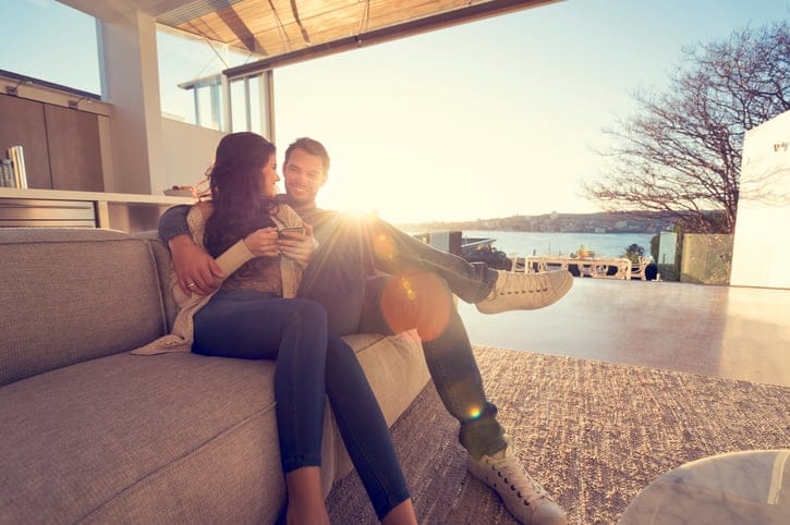 Couple sitting on sofa