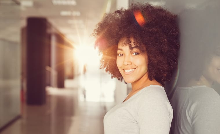 Portrait of beautiful mixed-race woman looking at camera