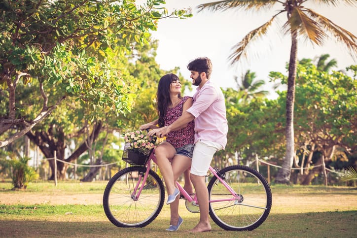 Loving couple riding bikes