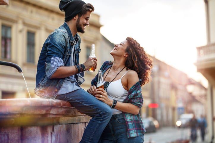 Young couple drinking beers