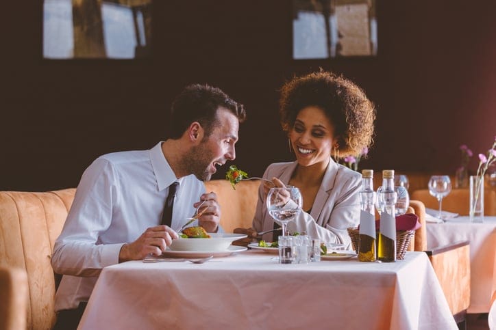 Flirting couple at dinner in the restaurant