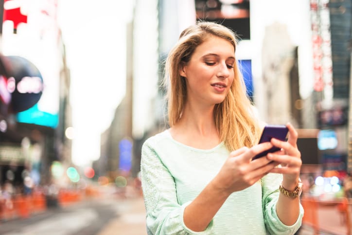 woman using the smartphone in times square - NYC