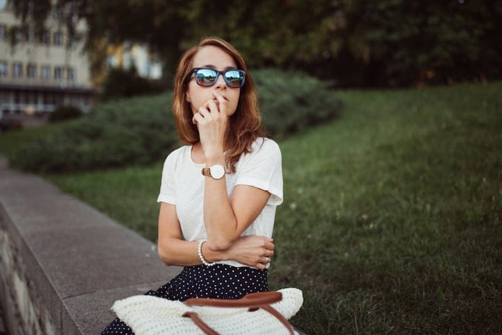 Young woman waiting for someone who is late