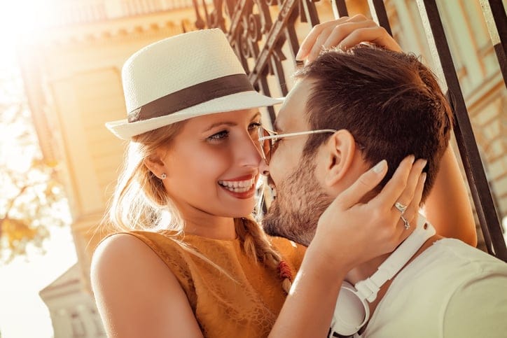 Image of a happy laughing couple in the city.