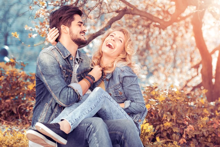Happy couple having fun on a sunny day in the city.