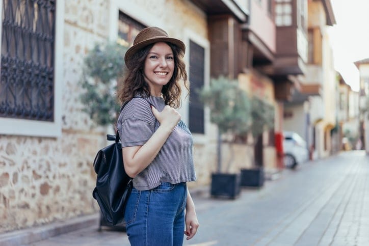 Woman tourist on the street traveling old city