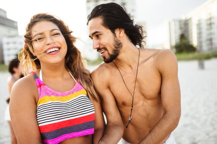 couple happy beach summer laughter romance