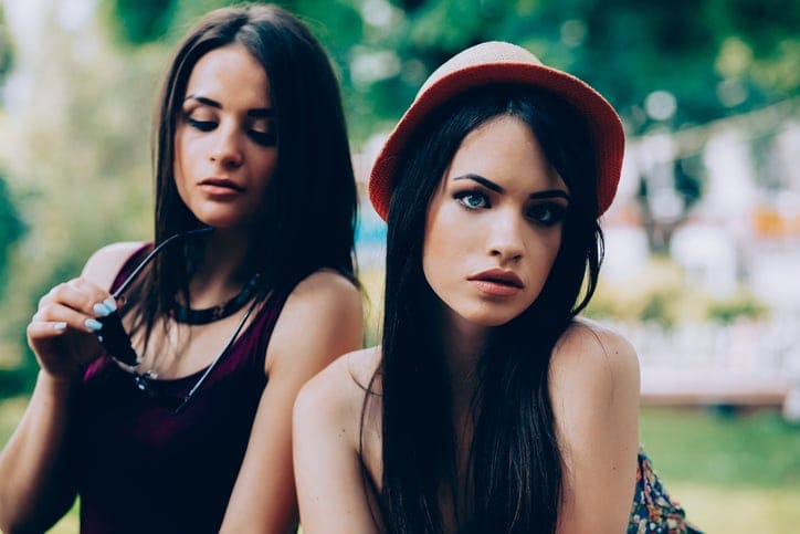 two girls outside staring