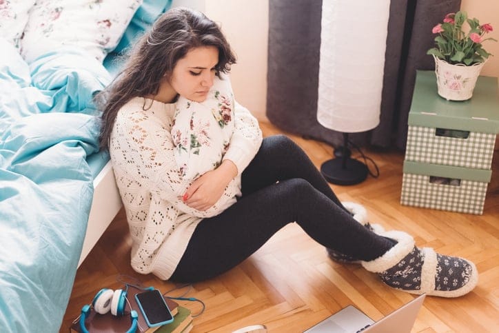 Unhappy teenage girl at home