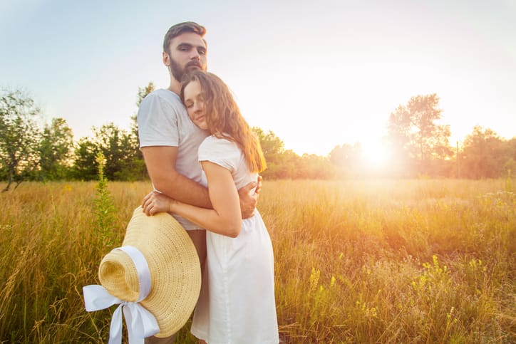 couple close hug romance date sunset