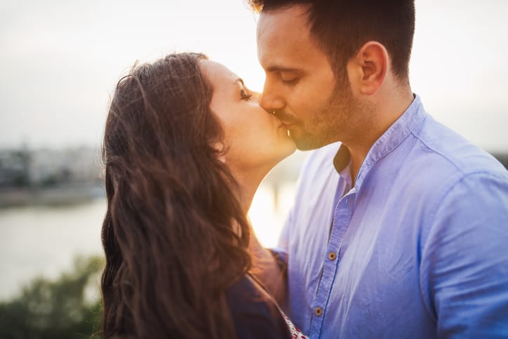 couple kiss romance sunset