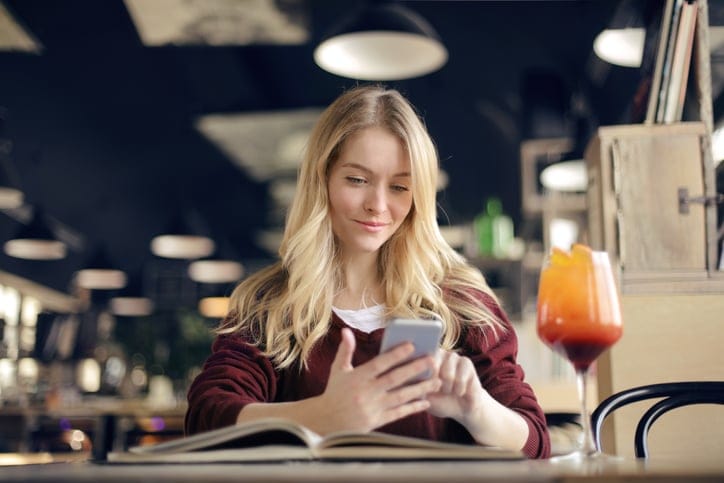 woman cafe drink dating profile phone
