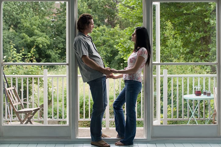 Couple standing in doorway