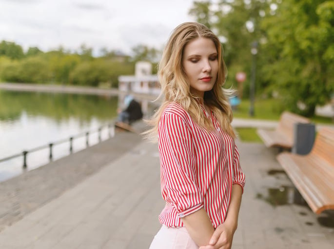 Outdoors portrait of beautiful young woman. Selective focus.