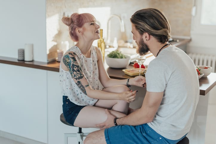 Husband is telling his wife funny jokes