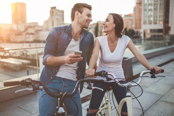 Romantic couple with bicycles in the city