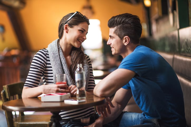 Smiling young couple looking at each other
