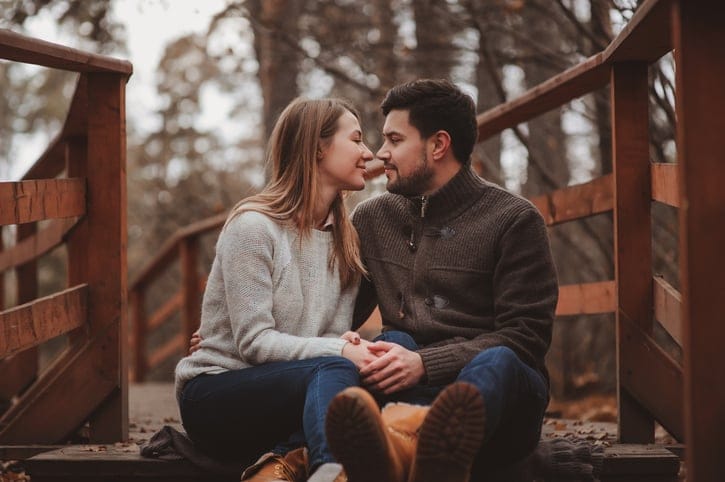 young couple happy together outdoor on cozy warm walk