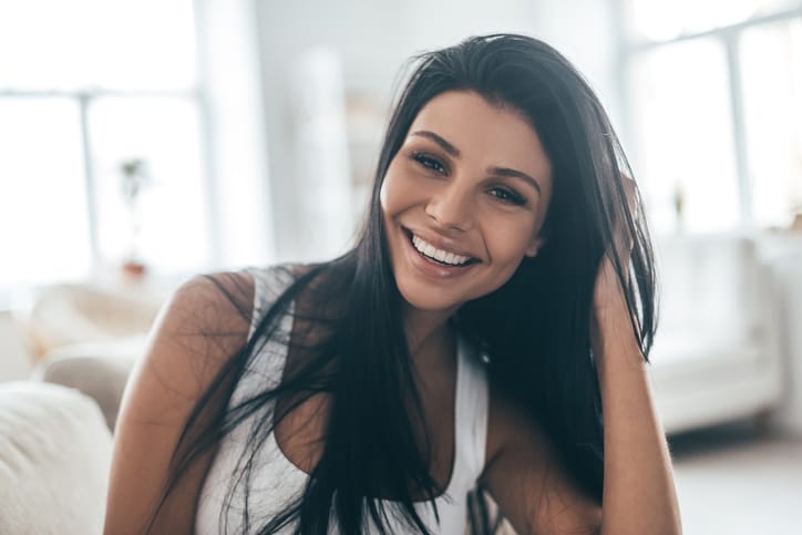 Young brunette woman smiling