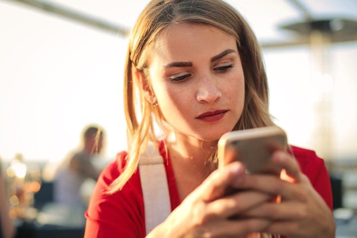 Young girl using her smart phone