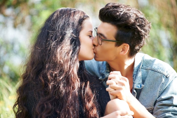 Sharing an intimate kiss