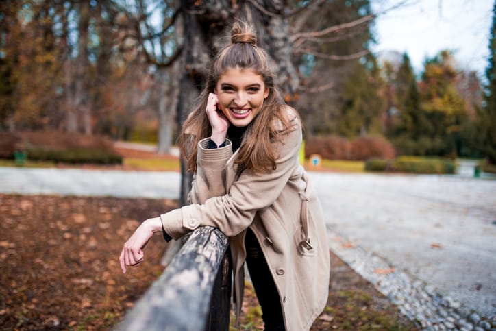 Portrait of a woman in the park looking at the camera