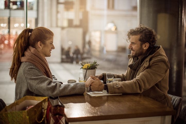 Couple drinking over a table