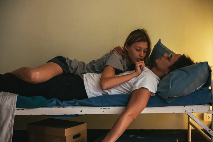couple laid sofabed