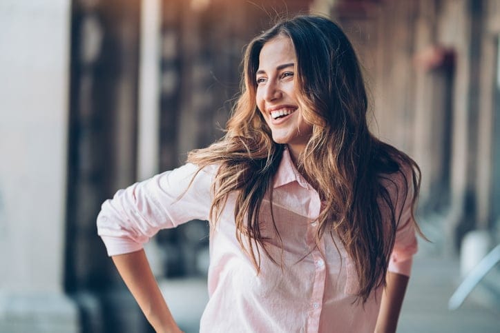 Portrait of a beautiful young laughing woman