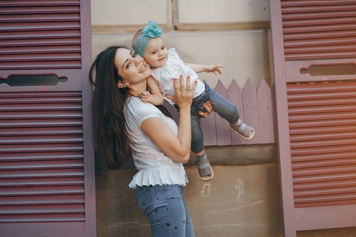 Woman holding her baby.