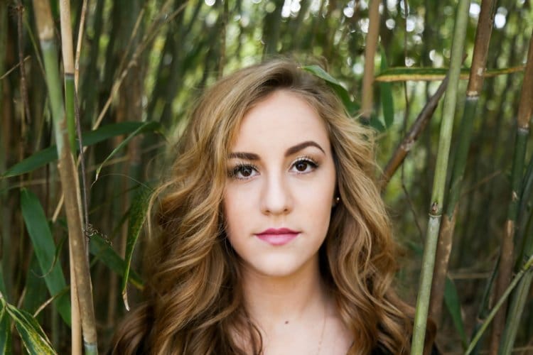 woman blonde trees